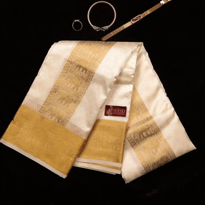 Horad Premium Art Silk Cream Emboss Elephant Shirt Material + Dhoti + Angavastram